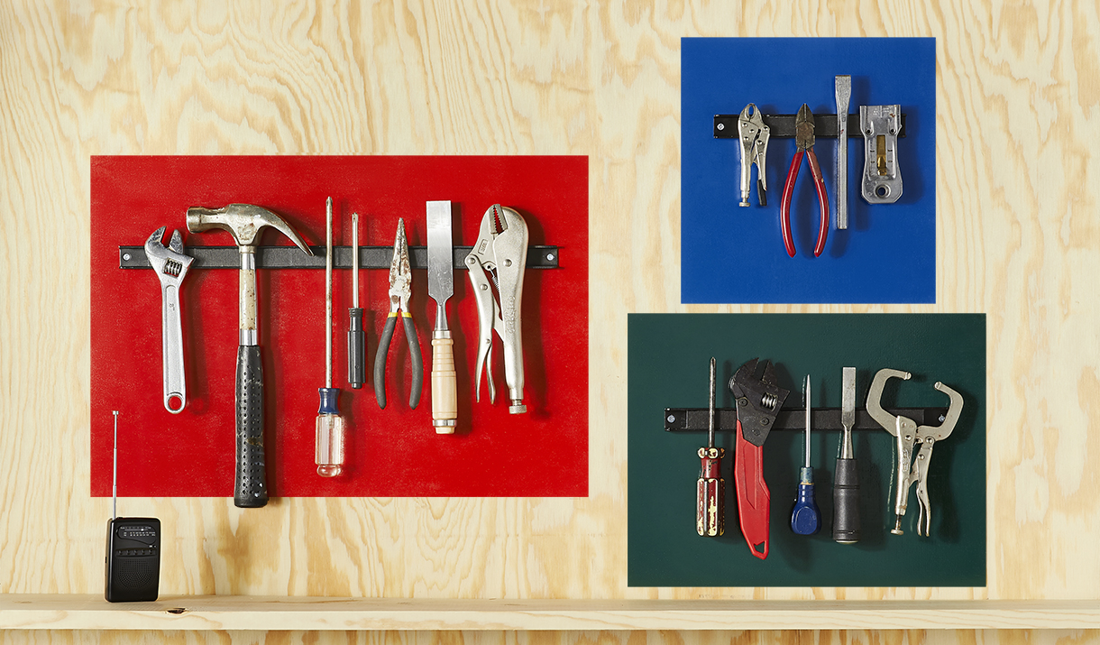 selection of hand tools on colored backgrounds