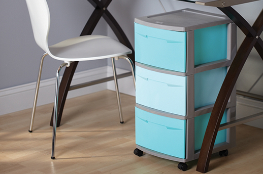 plastic storage container tower under a desk